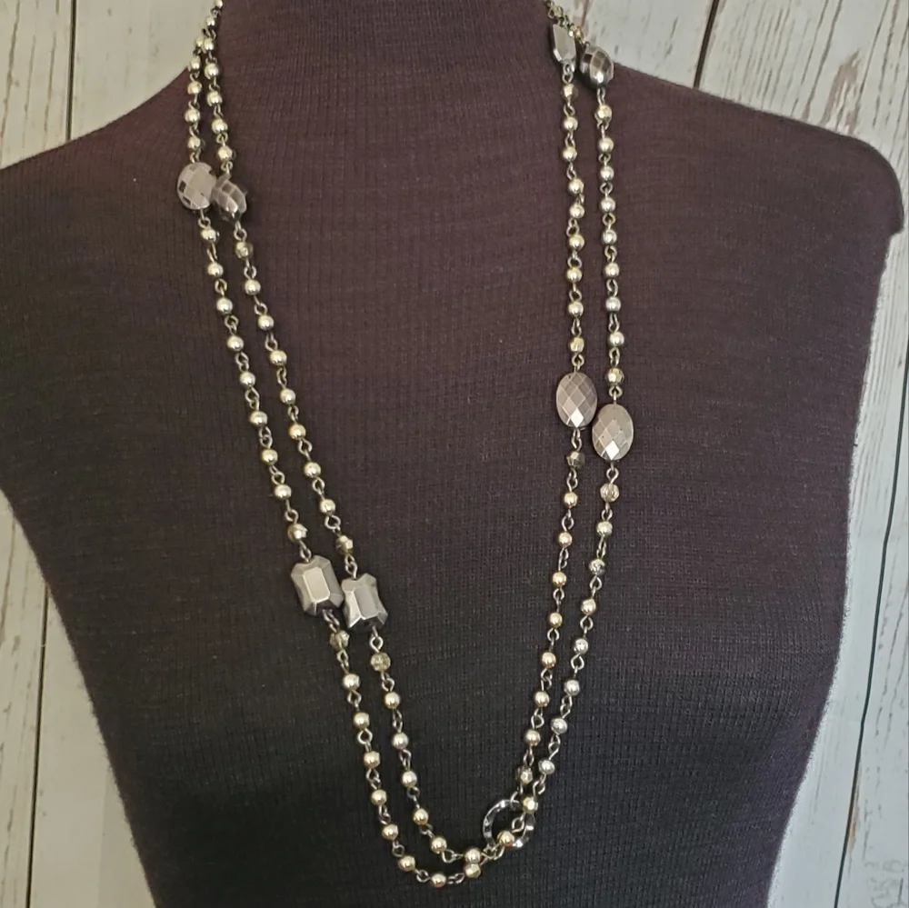 Silvertone and black bead and geometric stations necklace